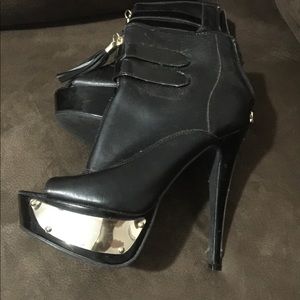 Black open toe booties. Stiletto with gold accents